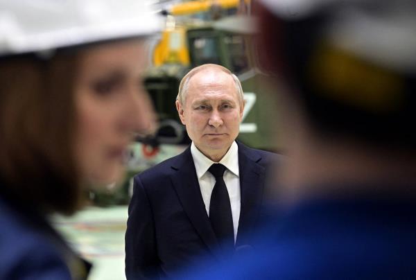 Russian President Vladimir Putin attends a meeting with employees of Obukhovsky plant, which is one of the production sites of the Russian missile manufacturer Almaz-Antey, in Saint Petersburg, Russia, on Jan. 18.  | SPUTNIK / POOL / VIA REUTERS
